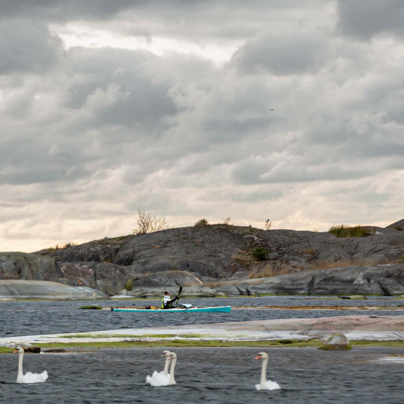 Person paddling in the kayak Melker Ulvön in Stockholms archipelago